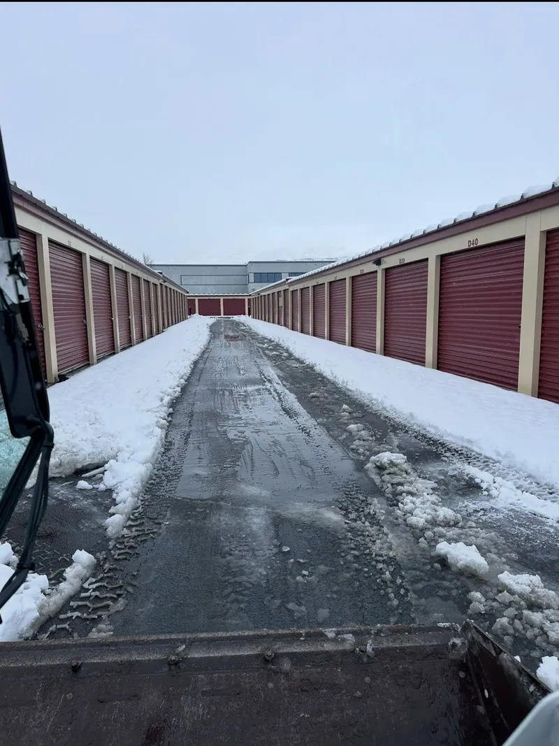 A storage facility aisle plowed clear of snow