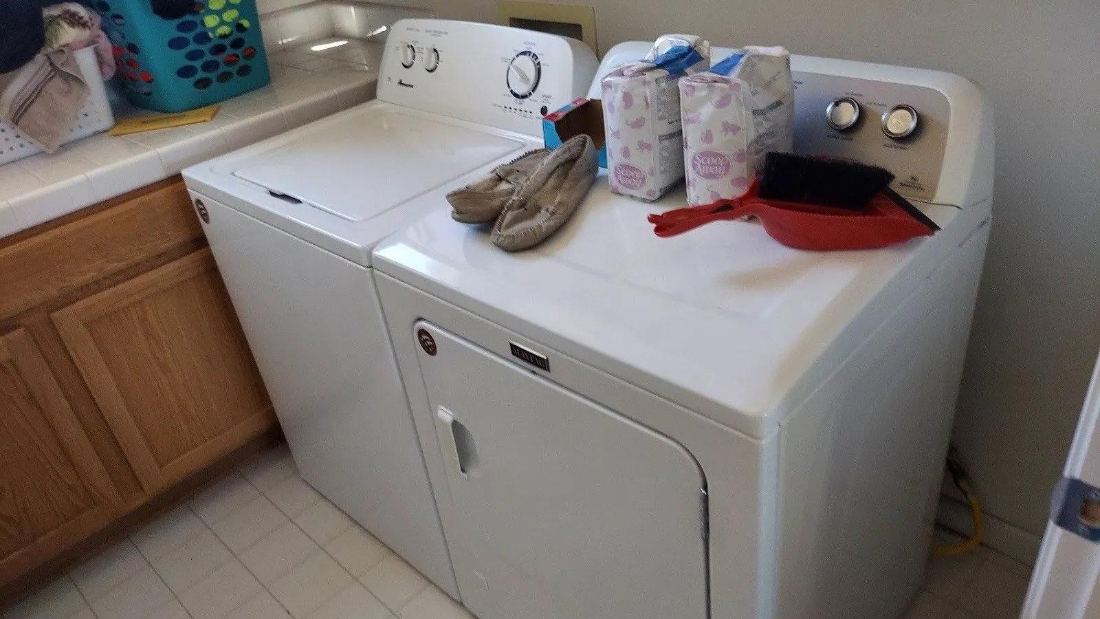 A white washer and dryer in a laundry room