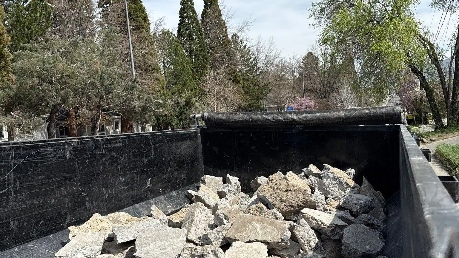 The dump trailer full of broken concrete