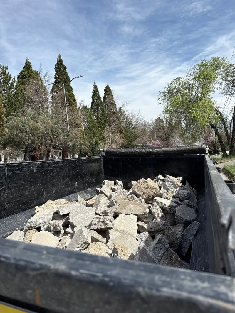 The dump trailer full of broken concrete