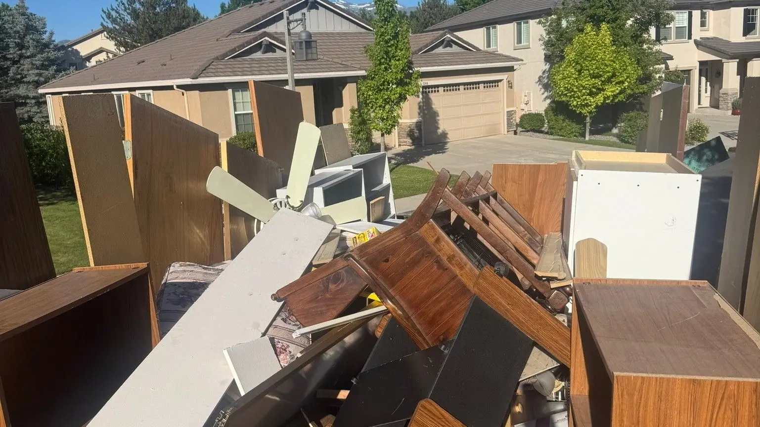 Wood dressers and furniture loaded in the dump trailer