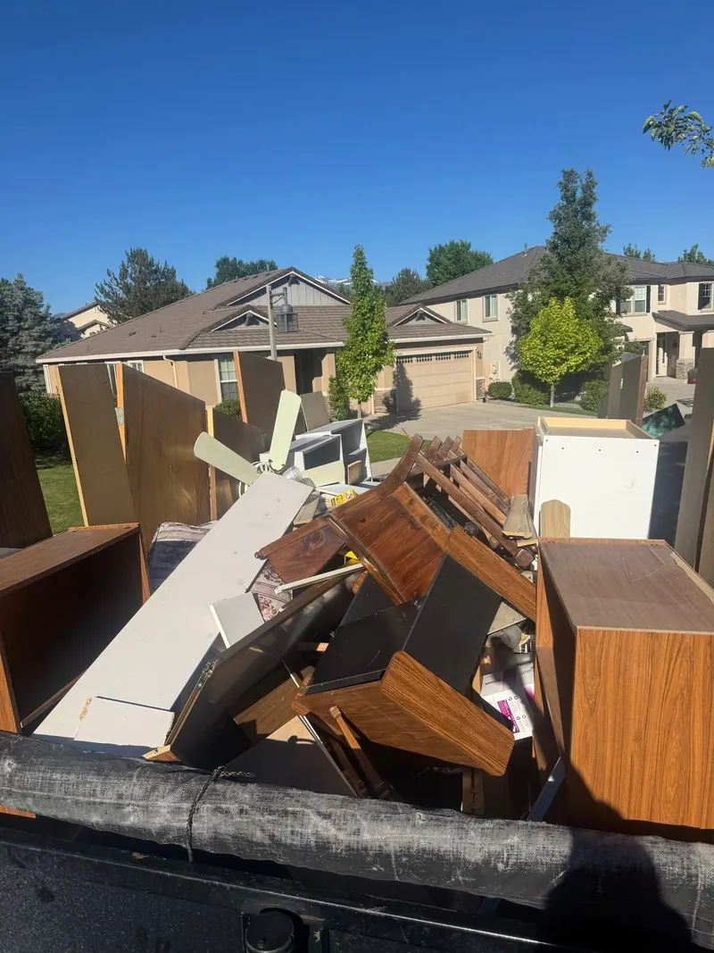 Wood dressers and furniture loaded in the dump trailer